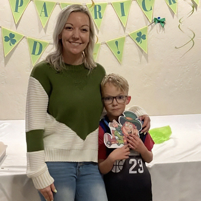 Woman and young boy at a St. Patrick&rsquo;s Day party, related to teen sending vile texts before mom and brother were found covered in blood