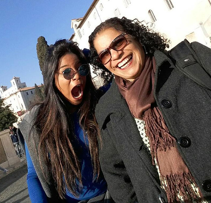 Mother and daughter smiling outdoors, related to mother revealing final text from hiker inside active volcano guide incident.