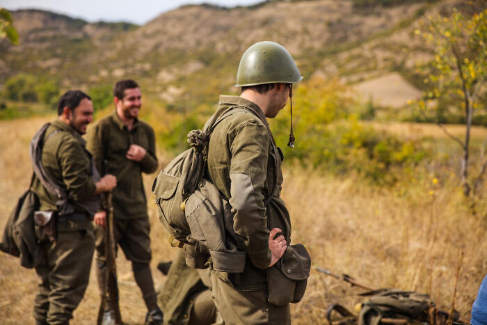 Soldiers in vintage military uniforms outdoors, illustrating bravery moments that changed the course of history. - 20