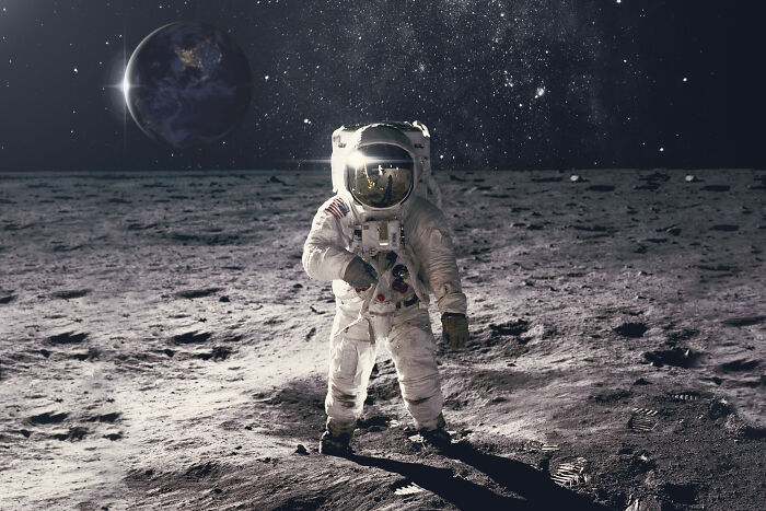 Astronaut on the moon symbolizing incredible bravery that changed the course of history during space exploration missions. - 14