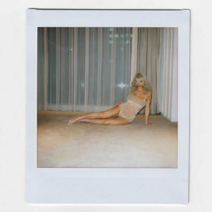 Newly blonde Bianca Censori posing in a sheer nightie indoors, photographed by Kanye West. Newly blonde Bianca Censori posing in a sheer nightie indoors, photographed by Kanye West.