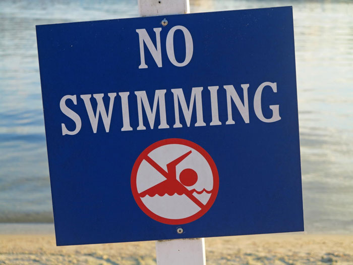 No swimming sign at a hotel pool, referencing karens kid poop, warning guests to avoid swimming in the pool water. - 14