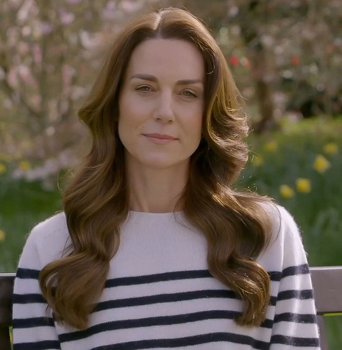 Kate Middleton sitting outdoors in a striped sweater, sharing a candid cancer confession that stuns royal fans.