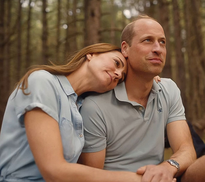 Kate Middleton and Prince William sitting outdoors, Kate looking reflective in a candid moment about cancer struggles.