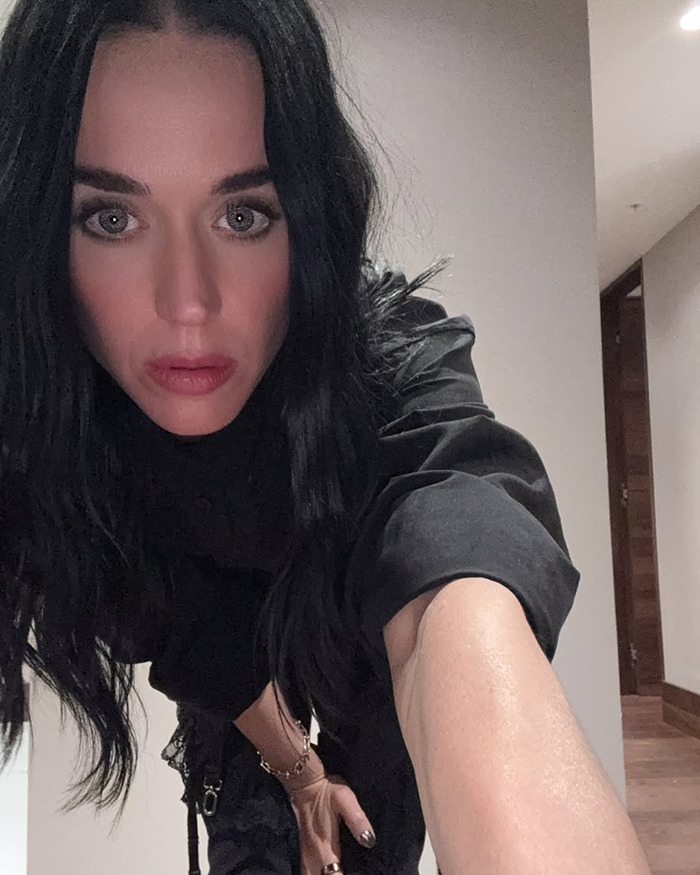 Katy Perry in a close-up selfie with dark hair and makeup, related to Katy Perry and Orlando Bloom breakup news. Katy Perry in a close-up selfie with dark hair and makeup, related to Katy Perry and Orlando Bloom breakup news.
