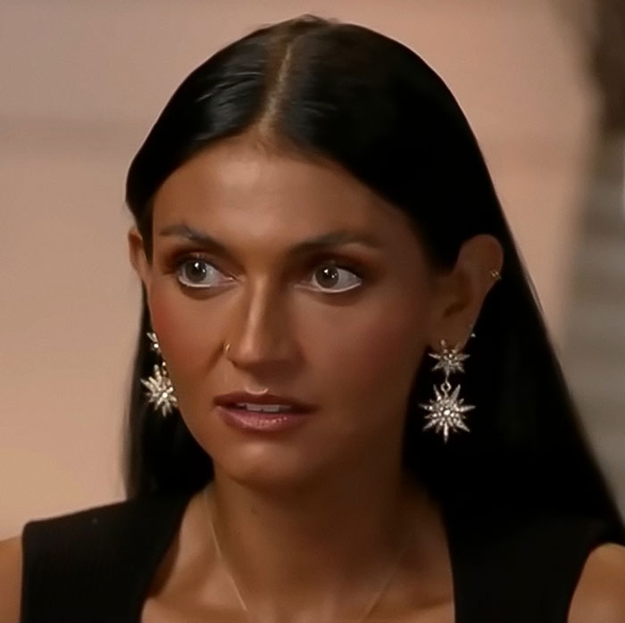 Woman with long dark hair and star-shaped earrings speaking during an interview about massacre victim Kaylee Goncalves’ sister Woman with long dark hair and star-shaped earrings speaking during an interview about massacre victim Kaylee Goncalves’ sister