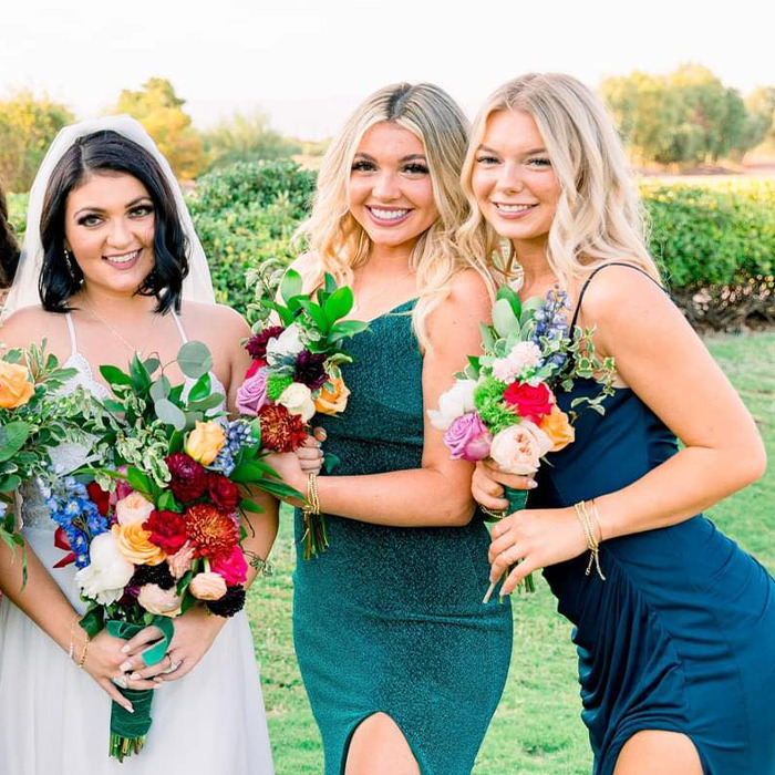 Kaylee Goncalves’ sister holding vibrant bouquets, smiling outdoors, capturing a moment before facing Bryan Kohberger in court - 5