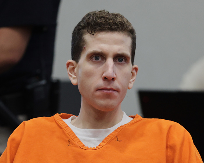 Bryan Kohberger wearing an orange prison uniform during a court hearing, facing charges related to Kaylee Goncalves case. - 2