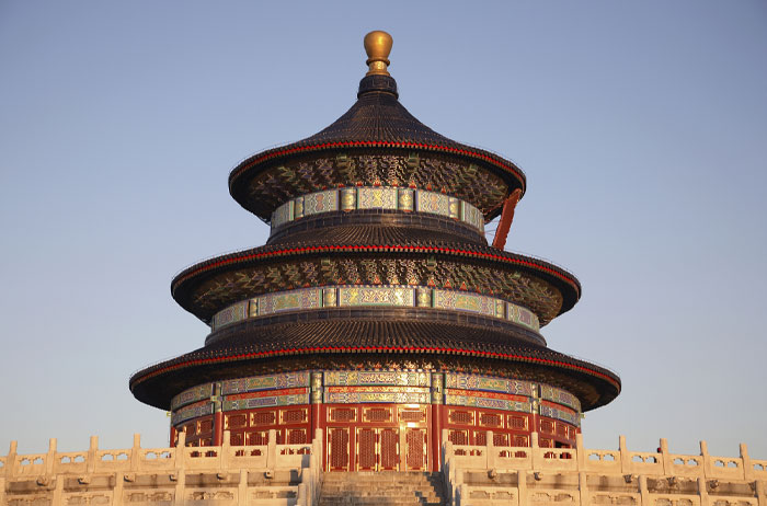 Traditional multi-tiered Chinese temple building under clear sky with no ladybug in sight. - 5