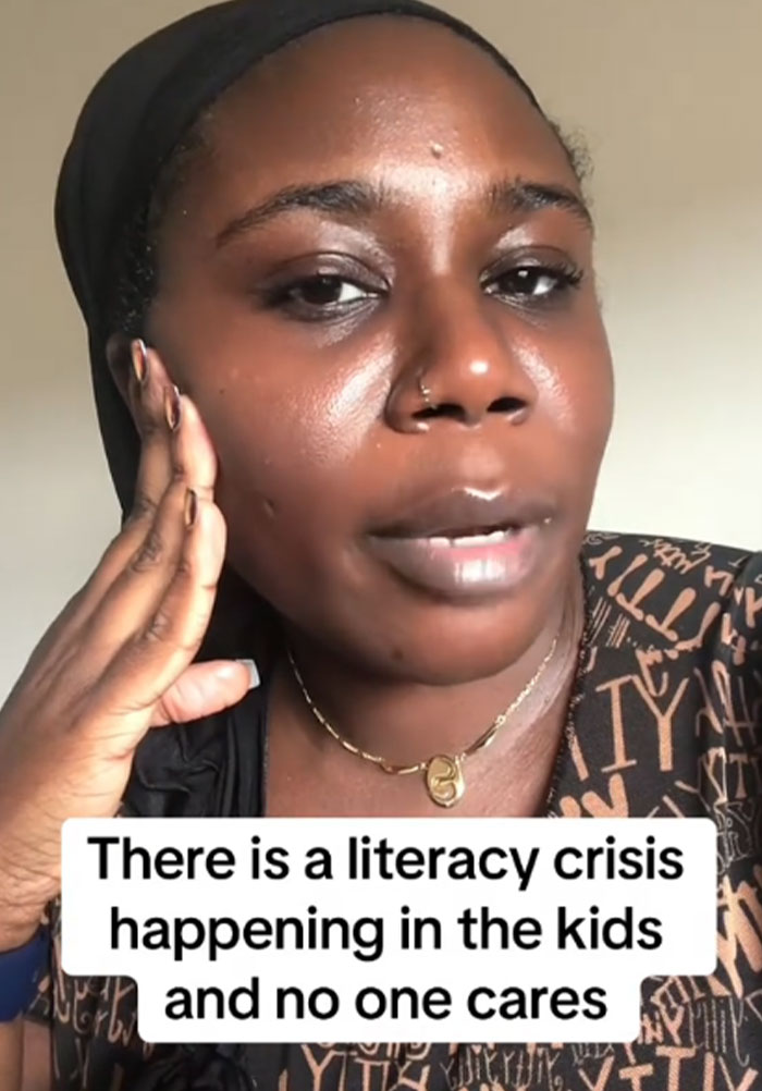Concerned US teacher discussing the urgent literacy crisis affecting kids and the lack of attention it receives.