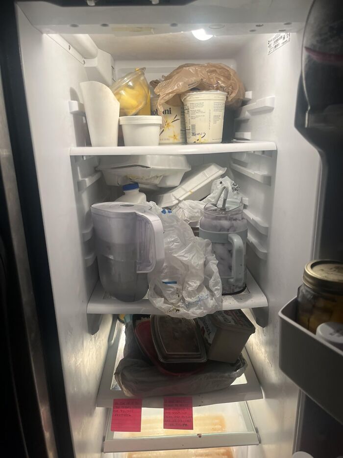Cluttered and messy fridge interior, illustrating common roommate problems from Reddit tales and their solutions.