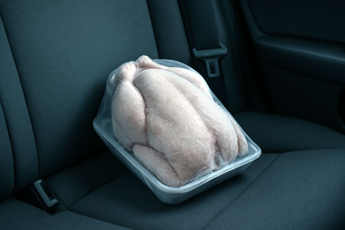 Raw chicken in plastic tray left on car seat trunk, husband declares it biohazard and refuses dinner over safety concerns. - 5