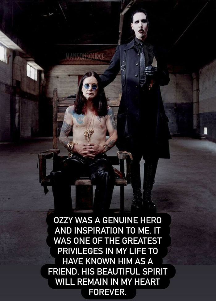 Ozzy Osbourne seated shirtless with long hair and sunglasses, with a gothic figure standing beside him in a dark room.