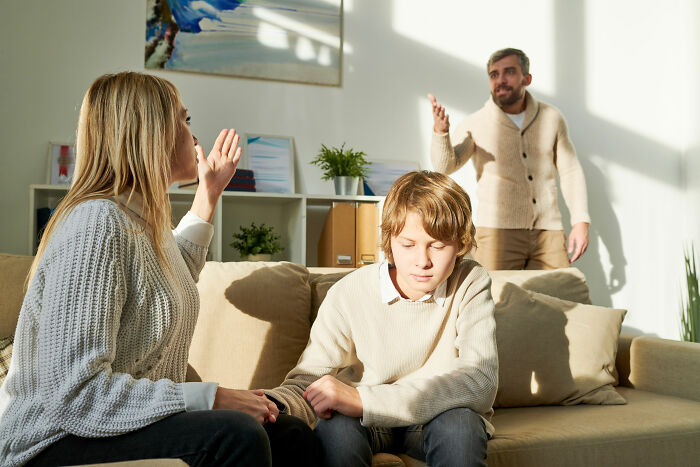Family arguing at home, showing tension and distress related to wife's infidelity and its impact on marriage and children.