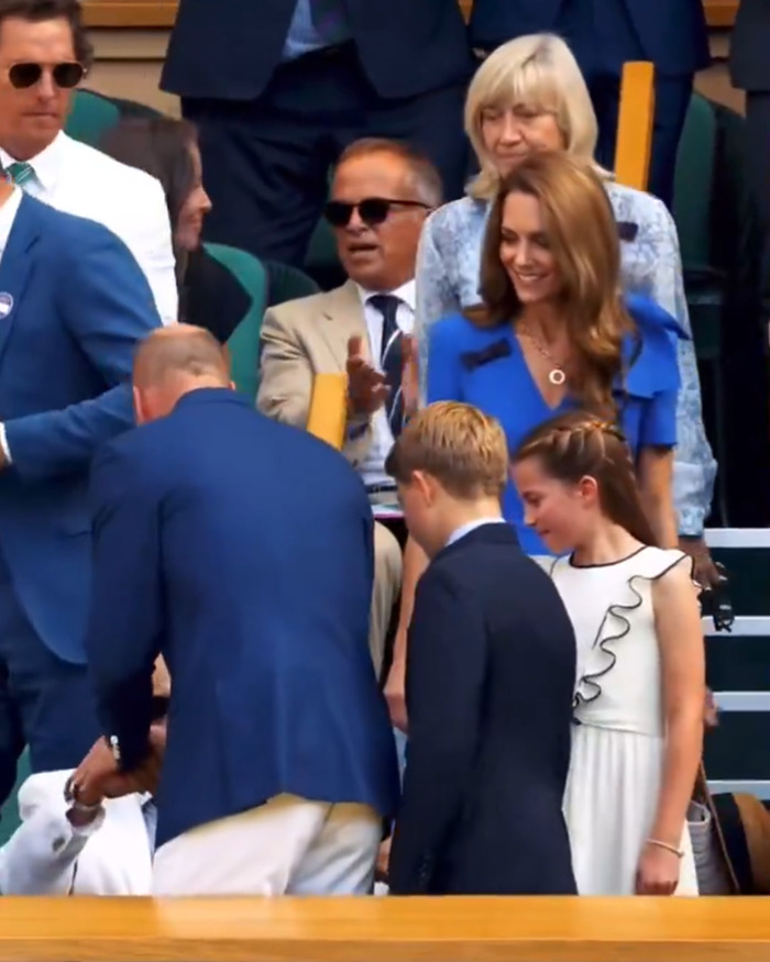 Matthew McConaughey in a blue blazer greeting British royalty at Wimbledon final with onlookers applauding nearby.