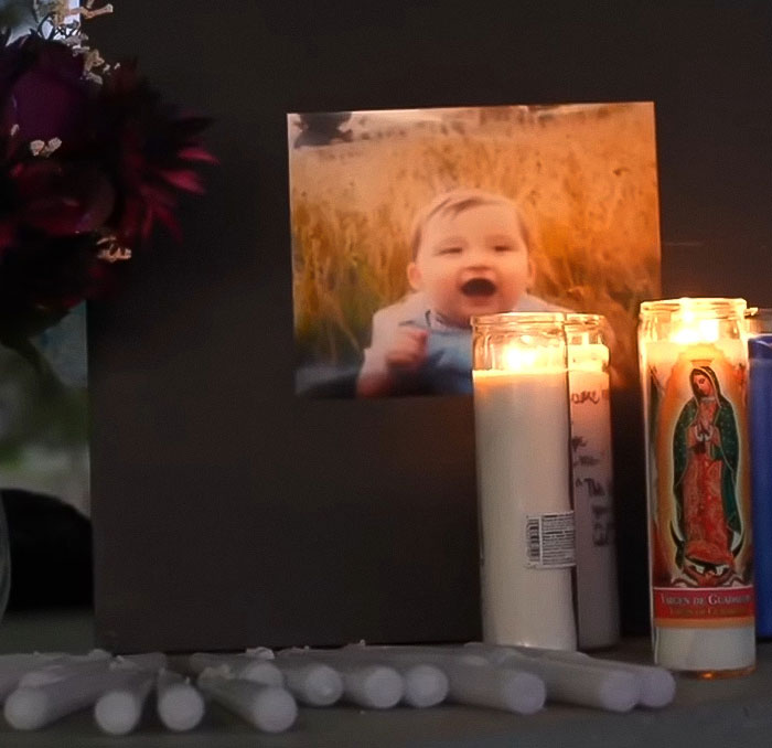 Memorial candles and photo of baby at vigil amid mass outrage over infant left in car during mom's lip filler appointment Memorial candles and photo of baby at vigil amid mass outrage over infant left in car during mom's lip filler appointment