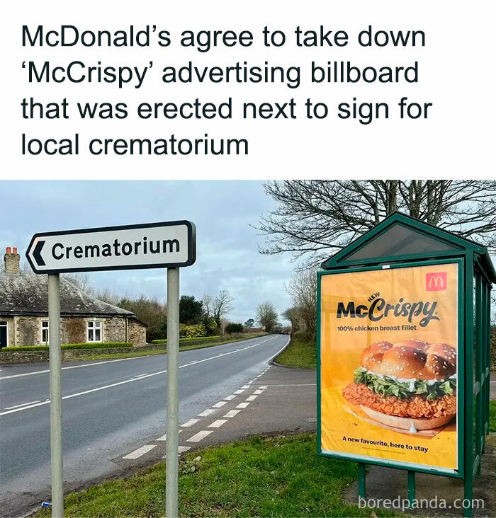 Road sign for crematorium next to a chaotic and random McDonald's McCrispy advertising billboard.