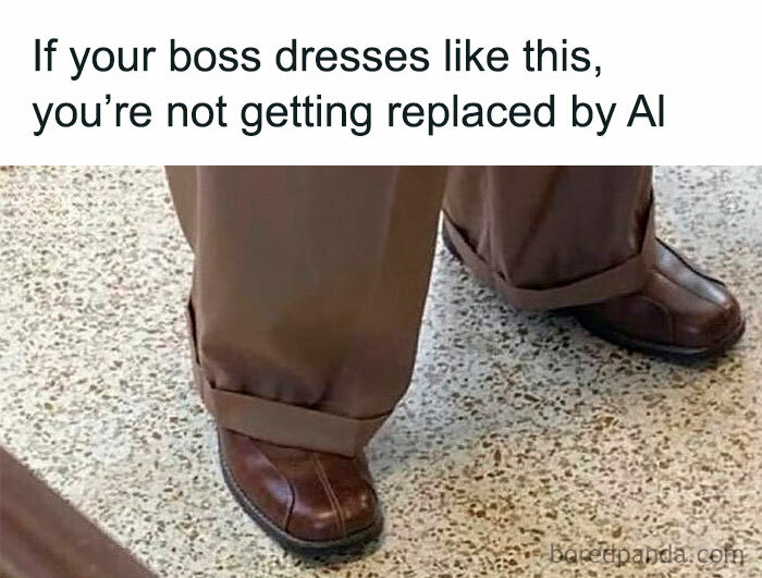 Brown leather shoes and baggy pants with text about bosses not being replaced by AI in a random and chaotic meme.