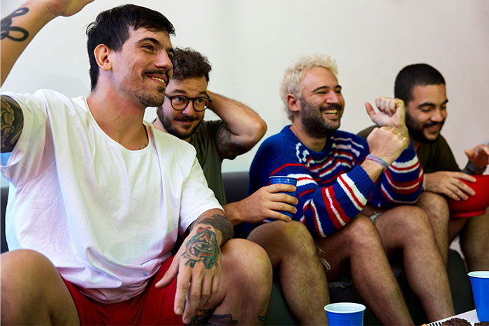 Group of men enjoying a casual gathering, sharing laughs and stories about things that drive their wives crazy