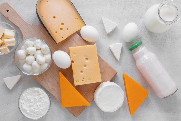 Assortment of dairy products and eggs representing allergy incidents linked to woman replacing MIL as caregiver