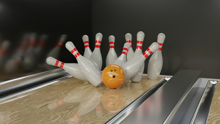 Bowling ball striking pins on a polished wooden lane, illustrating items that made medical professionals gasp.