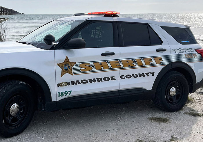 Monroe County sheriff vehicle parked by the water, related to Florida woman attack on driver over chicken incident. - 2