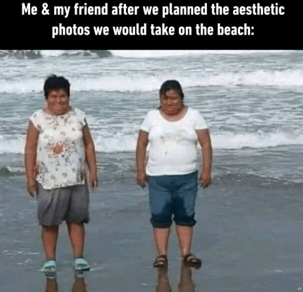 Two women standing awkwardly at the beach with wet clothes, representing funny summer memes about enjoying being outside.