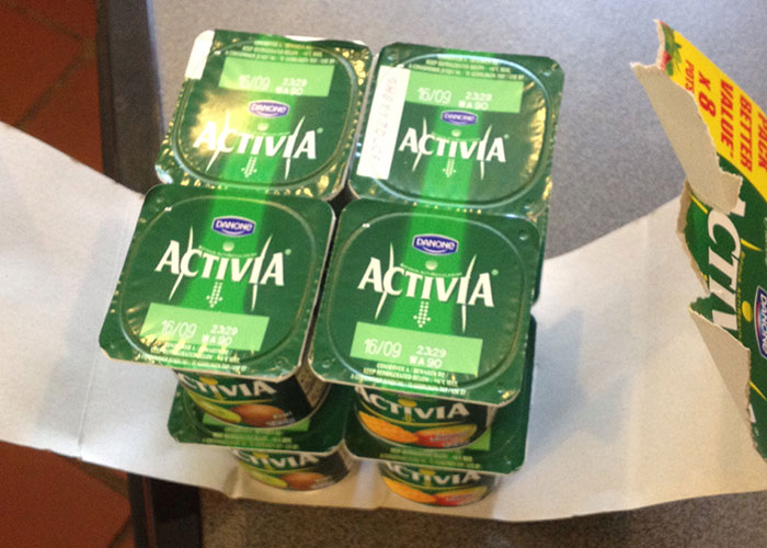 Pack of six Danone Activia yogurt containers arranged on a table, illustrating powerful marketing campaigns.