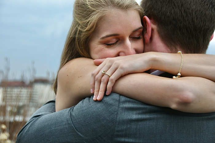Young woman embracing a man tightly, illustrating emotional tension in a 30-year-old friendship story before a wedding. Young woman embracing a man tightly, illustrating emotional tension in a 30-year-old friendship story before a wedding.