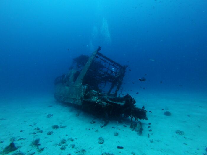 Underwater image of a sunken shipwreck representing rare phobias related to deep water and the ocean. - 38