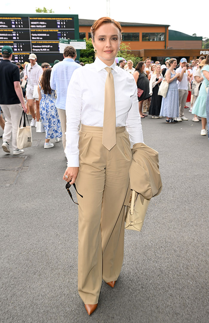 Celebrity at Wimbledon 2025 wearing beige suit and tie, showcasing one of the best and worst Wimbledon 2025 celebrity looks.
