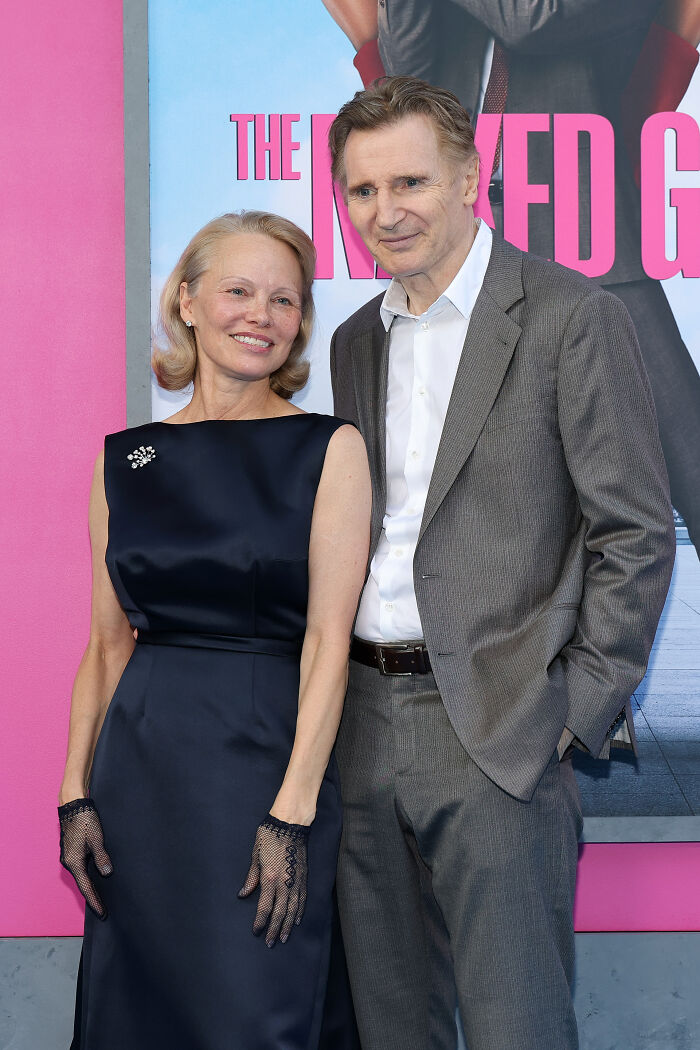 Pamela Anderson and Liam Neeson posing together at an event, linked to dating rumors and public sightings. - 1