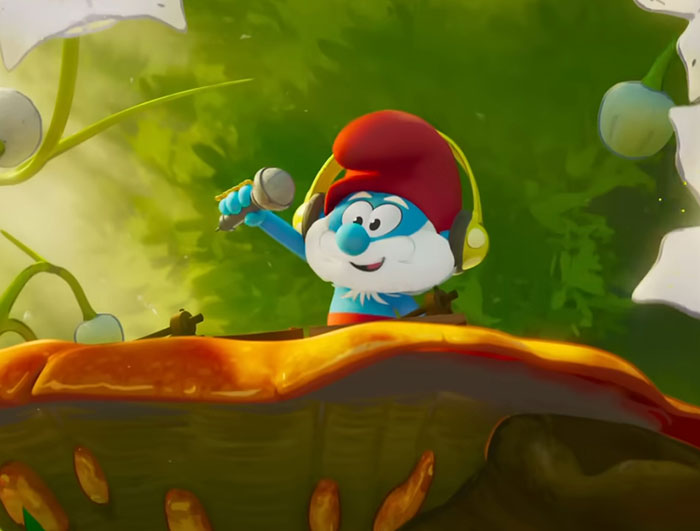 Smurf character wearing headphones and holding a microphone, animated scene with a green leafy background.