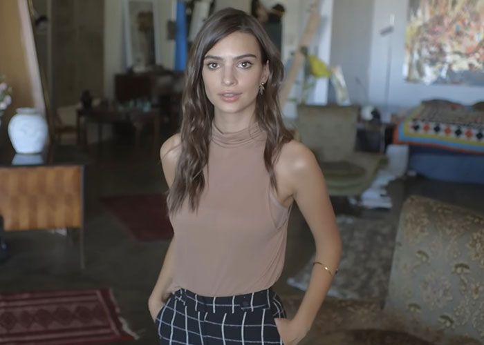 Young woman posing indoors in a casual setting, related to people who went to school with celebrities and shared stories.