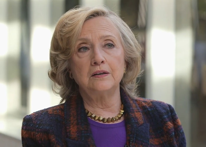 Older woman speaking during an interview, sharing stories about people who went to school with celebrities.