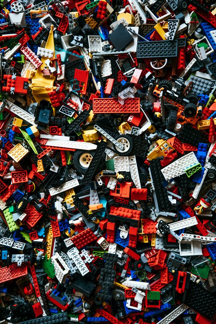 Colorful scattered LEGO pieces symbolize complexity and red flags in relationships needing a parent, not a partner. - 10