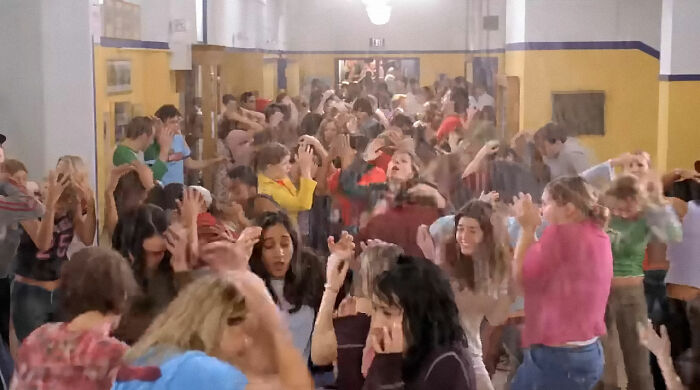 Crowded hallway full of stressed people illustrating chaos and secrets companies keep from their customers. - 34