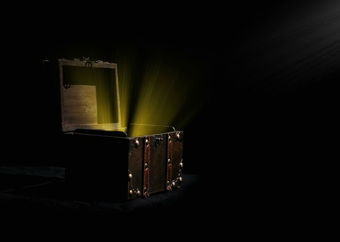 Open vintage treasure chest with glowing golden light shining out, symbolizing hidden pickup lines secrets.