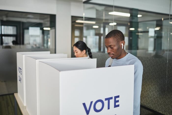 Two people voting at polling booths in an office setting, highlighting toxic relationships and personal awareness. - 8