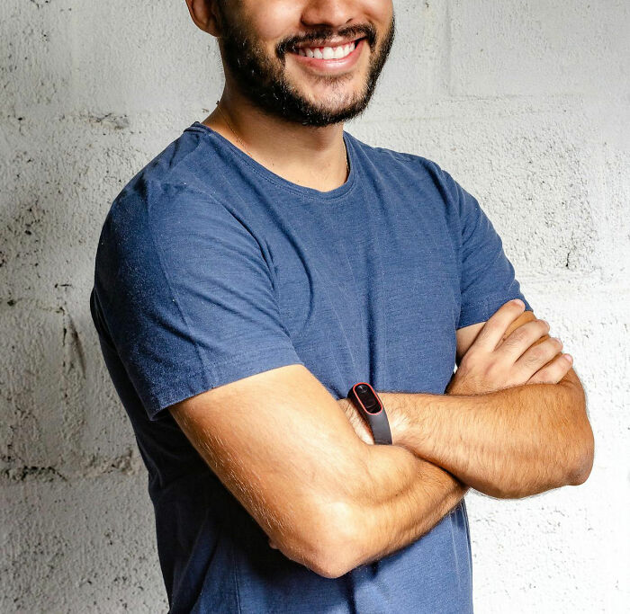 Man with arms crossed smiling confidently, symbolizing people who took revenge on their bosses. - 2