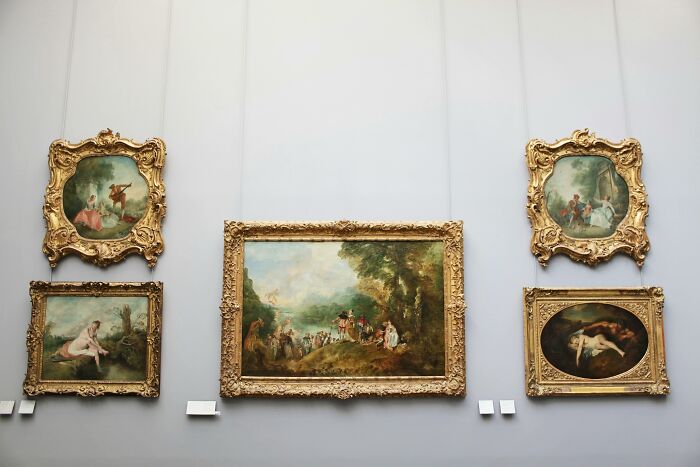 Five framed paintings by various painters displayed on a gallery wall for true art buffs to identify. Five framed paintings by various painters displayed on a gallery wall for true art buffs to identify.