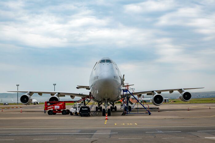 Large collectible airplane on tarmac undergoing maintenance, representing one of the highest-value collectible items sold.