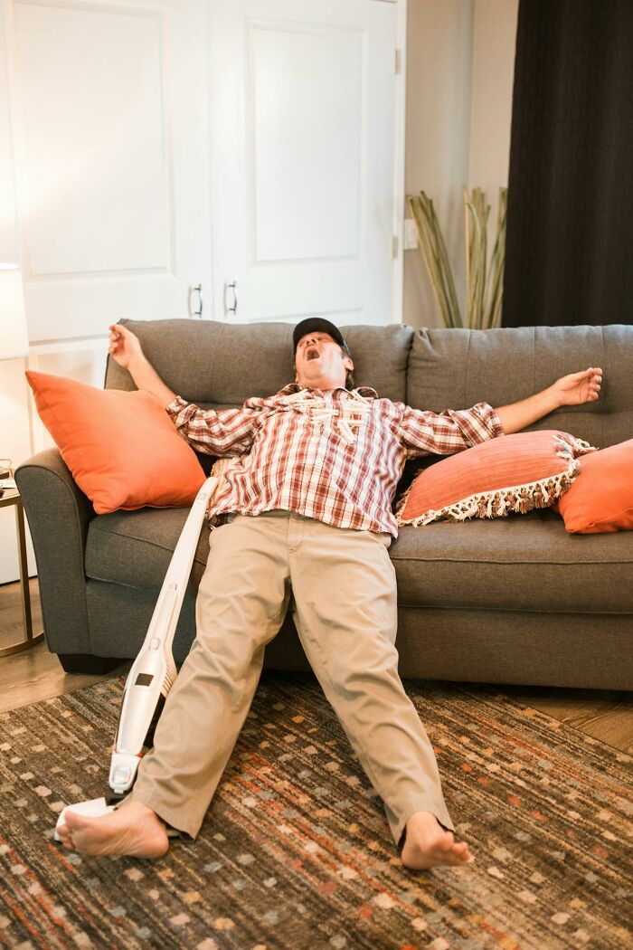 Older man relaxing on floor near couch with vacuum, illustrating life after divorce for older people. - 12
