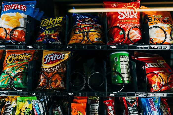 Vending machine stocked with snacks, illustrating a common convenience for night shift workers during overnight hours. - 16