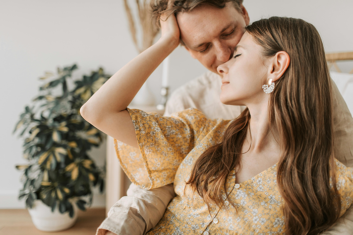 Couple sharing an intimate moment indoors, highlighting tension related to 30-year-old friendship and wedding weight demand. Couple sharing an intimate moment indoors, highlighting tension related to 30-year-old friendship and wedding weight demand.
