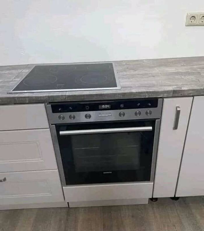 Modern kitchen stove with oven that highlights hilariously dumb engineering mistakes in design or installation.