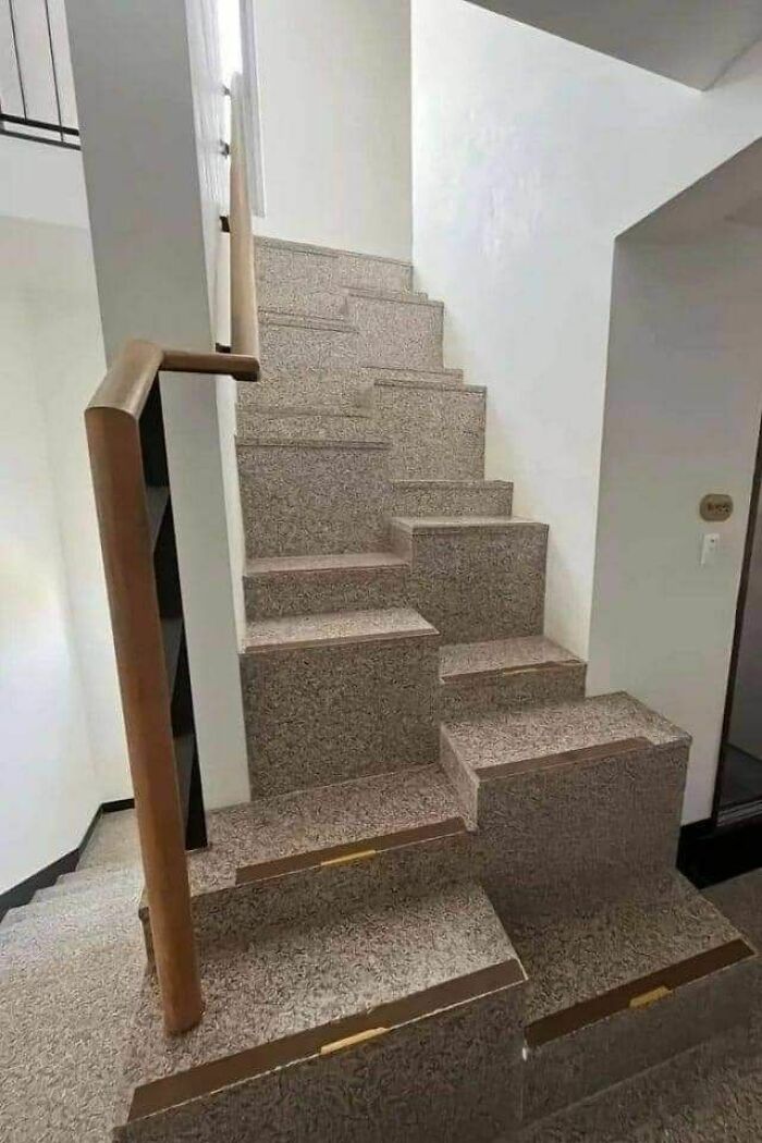 Confusing staircase design showing hilariously dumb mistakes despite engineering degrees, with broken steps and awkward rail placement.