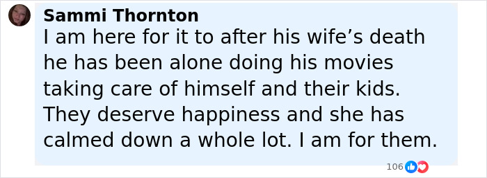 Pamela Anderson and Liam Neeson sharing a close moment, showing affection on the latest red carpet event.