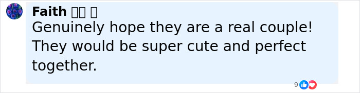 Pamela Anderson and Liam Neeson touching hands and sharing a close moment on the red carpet event.