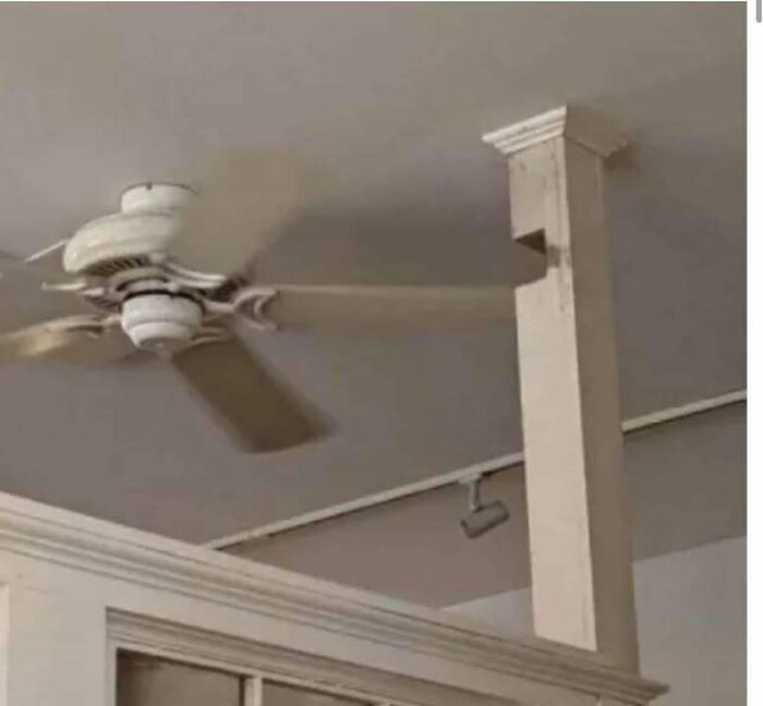 Ceiling fan blades hitting a structural beam, showcasing one of the hilariously dumb engineering mistakes.